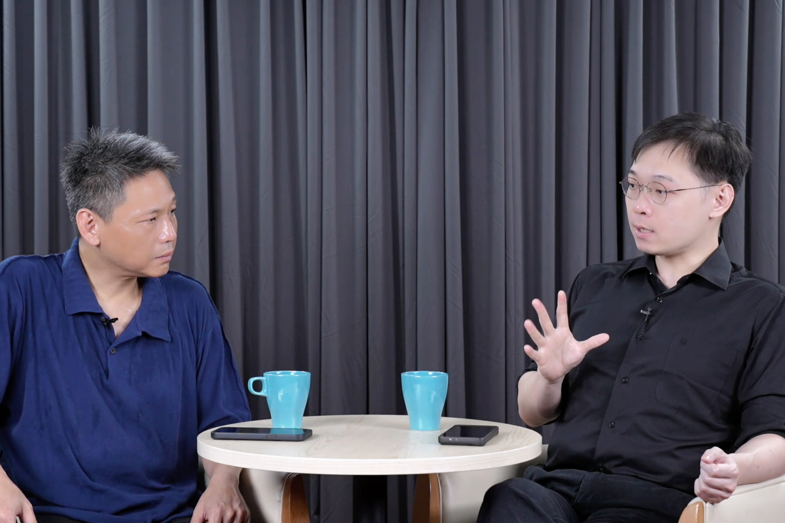 黃士修（右）與謝寒冰（右）都認為民進黨對這次公投態度低調許多。圖/記者陳思豪攝